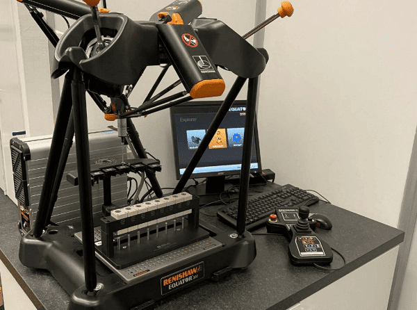 Verus Metrology Fixture Holding Tubes and Caps for Inspection on the Equator™ 300 Gauging System