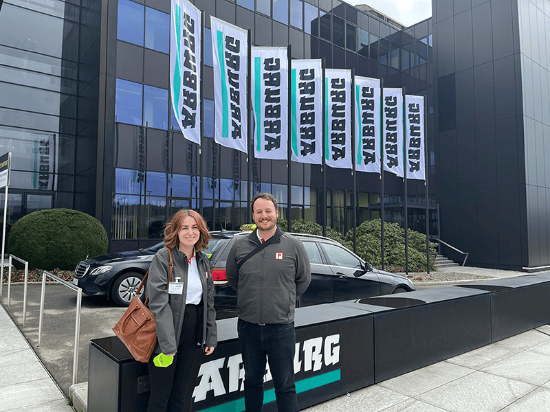 Jess Clarke and Will Clarke outside Arburg HQ