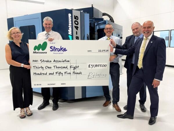Matsuura team with charity check