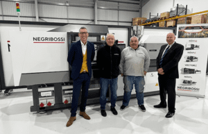 Negri Bossi team in front of a machine