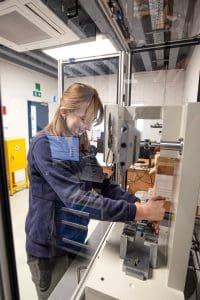 A Broadway mechanic doing tests in the Broadway lab