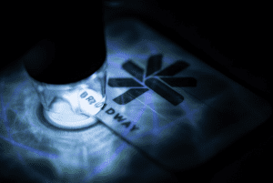 Laser-marked plaque undergoing quality analysis